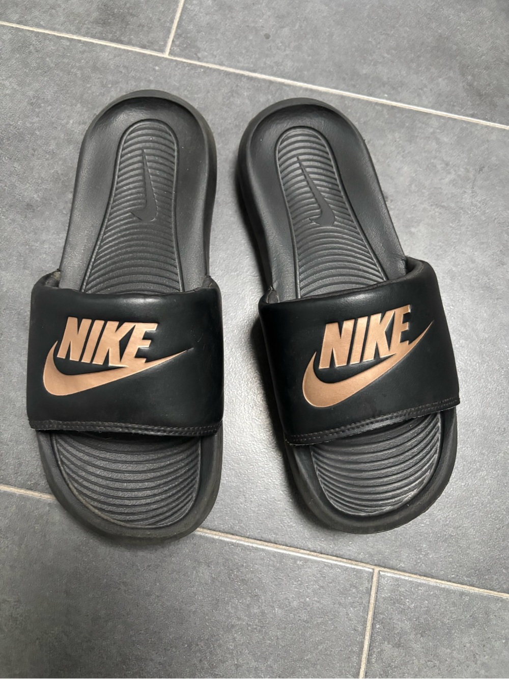 Nike Black Slip-On Sandals with Metallic Logo Accent
